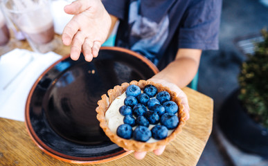 Dessert with blueberries in an edible basket