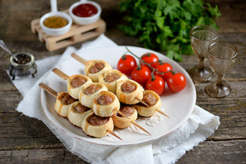 Meatballs baked in puff pastry.