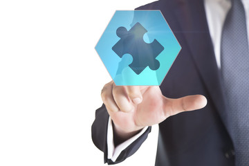 Mergers and acquisition concept with consultant touching icons of puzzle pieces representing the merging of two companies or joint venture, partnership 