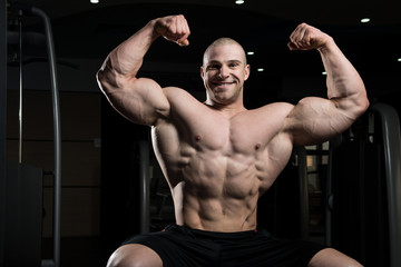 Bodybuilder Flexing Muscles