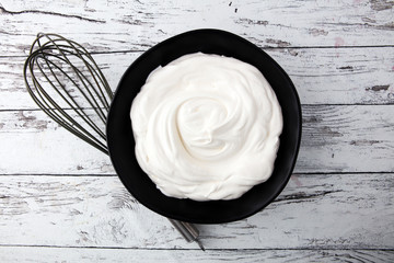 close up of a white whipped or sour cream in bowl