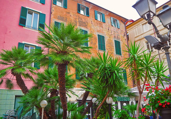 Fototapeta na wymiar Colorful facades of famous resort Alassio (province of Savona) on the Italian Riviera in Western Liguria, Italy