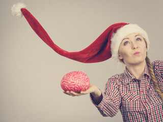 Happy woman wearing Santa Claus helper hat