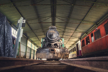 Front View of an Old Steam Locomotive Standing in the Depo