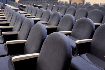 The rows of empty seats in the auditorium