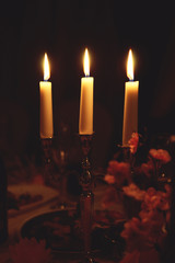 Candlestick with candles on a dark background