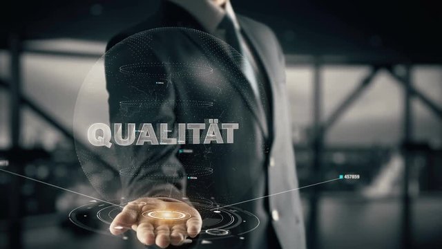 Qualität with hologram businessman concept, in English Quality