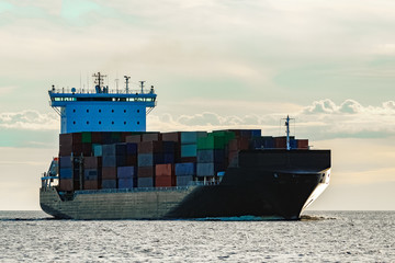 Black container ship underway