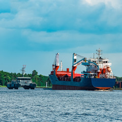 Fototapeta premium Blue cargo ship underway