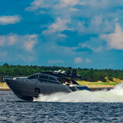 Grey motor yacht in move