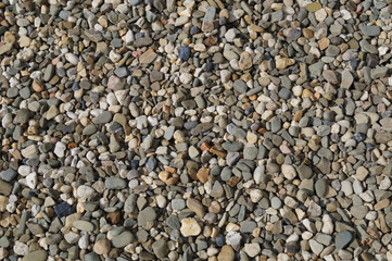Background composed of thousands of small stones, horizontal frame