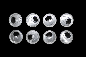 eight tin cans on a black background