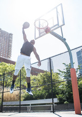 Basketball player playing outdoors