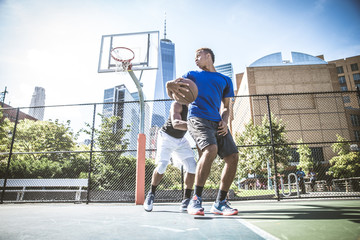 Fototapeta na wymiar Basketball player playing outdoors