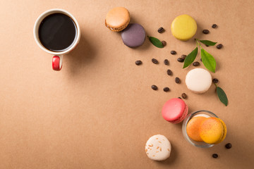 Colorful macaroons. Sweet macarons on retro background .