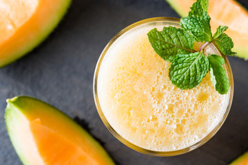 The juice of melon with mint in a glass  on the table.