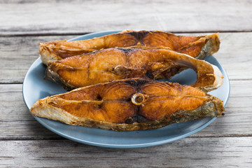 Deep fried fish on wooden table