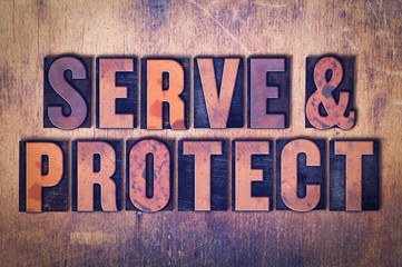 Serve & Protect Theme Letterpress Word on Wood Background