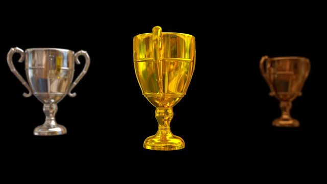 Animated plain silver, gold and bronze trophy with shinning surface spinning against black background. Gold trophy in main focus. Isolated and loop able, mask included. Gold trophy in main focus.