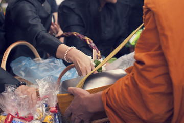 make merit make offerings to the monk In Buddhism