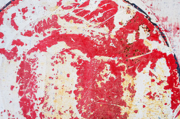 Grungy red and white metal plate