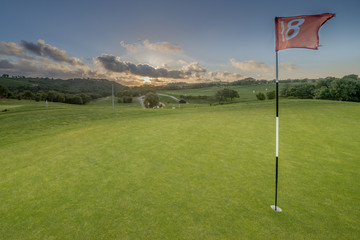 Obraz premium Green grass at sunset. Golf courses. Portugal.