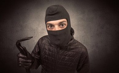 Burglar with tool.