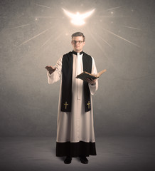 young priest in giving his blessing