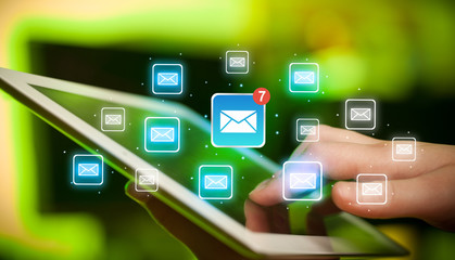 Fingers touching tablet with mail
