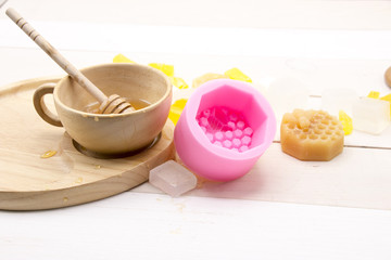Honey soap on white wooden background