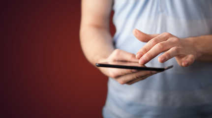 Close up of hand holding digital touchpad tablet device