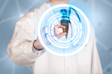 Male doctor holding a pill with glowing circles