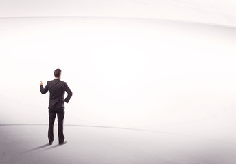 Businessman with briefcase standing still