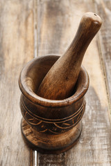 Wooden mortar on table