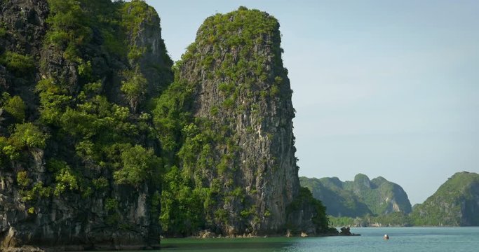 Sailing past some of the many tropical islands of Halong Bay Vietnam.