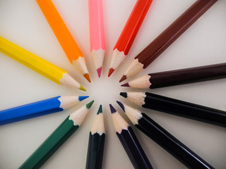 Wooden crayons arranged colours  in circle order