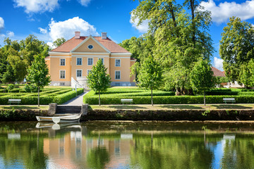 An old manor house in Estonia. Beautiful summer landscape