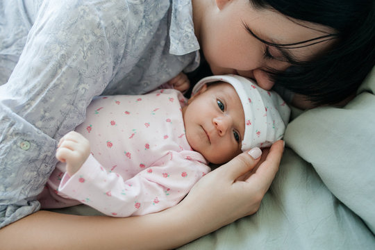 A Mother's Daytime Sleep With Her Newborn Baby. Tired But Happy. Family Values.