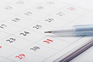 Check out the dates in a business calendar concept