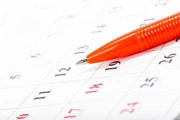 Check out the dates in a business calendar concept