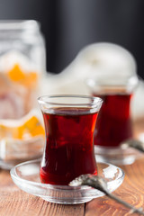 Red tea in turkish glasses on a wooden table