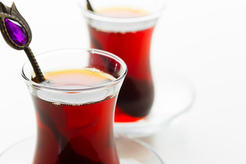 Turkish tea in traditional glass isolated on white background