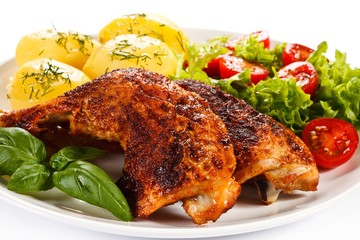 Roast chicken legs with boiled potatoes and vegetables 