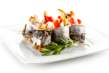 Marinated herring fillets on white background 