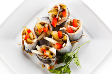 Marinated herring fillets on white background 