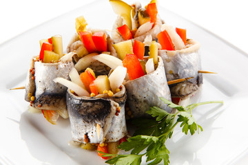 Marinated herring fillets on white background 