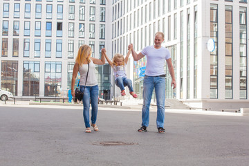 stylish young family in the same clothes for a walk