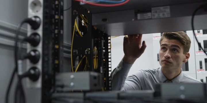 A Man Working In A Server Room. Shot on RED Helium 8K