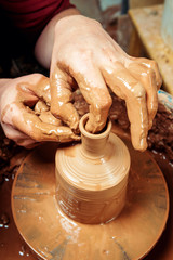 Potter at work. Workshop place.