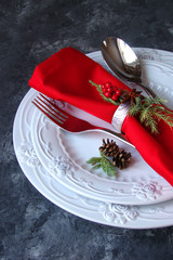 Christmas table setting with red cloth and Christmas decorations